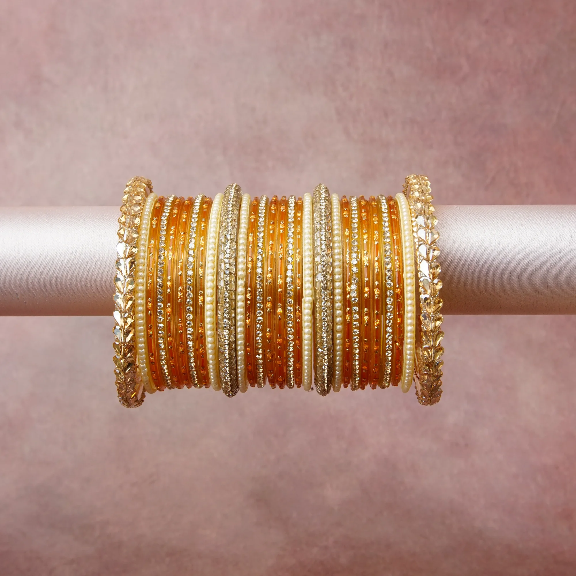 A grounding Orange forms the heart of the set, while touches of Rich Gold, Ivory, Clear Crystal add charm.

A thoughtful composition of Glass, Imitation Pearl, Rhinestone, Gold-toned Metal, designed to feel complete without being heavy.
Each element layers seamlessly, creating a look that is refined, wearable and quietly striking.